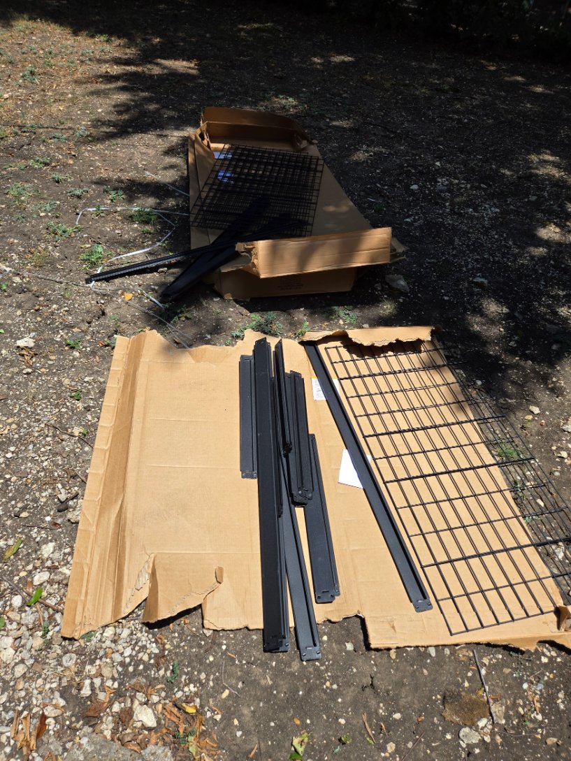 Unpacked parts of a Husky industrial steel shelving unit, assembly by Mount & Fix Fort Worth