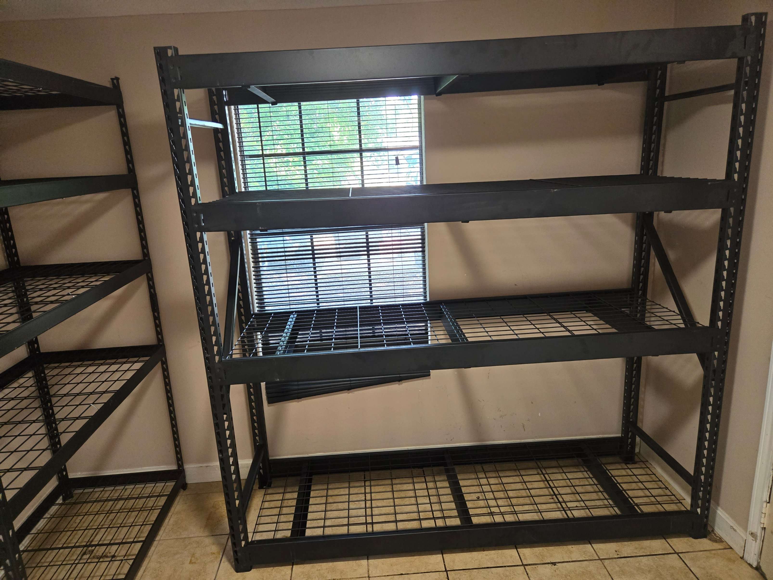 Husky 4-tier industrial steel shelving unit during assembly by Mount & Fix Dallas