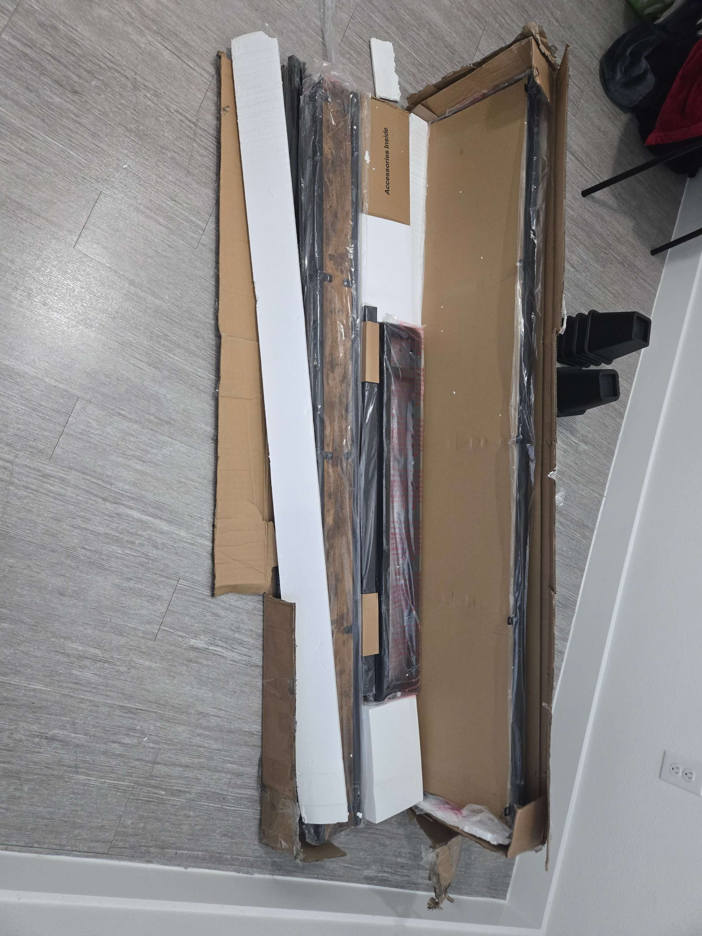 Unpacked IKEA furniture components ready for assembly by Mount & Fix Dallas