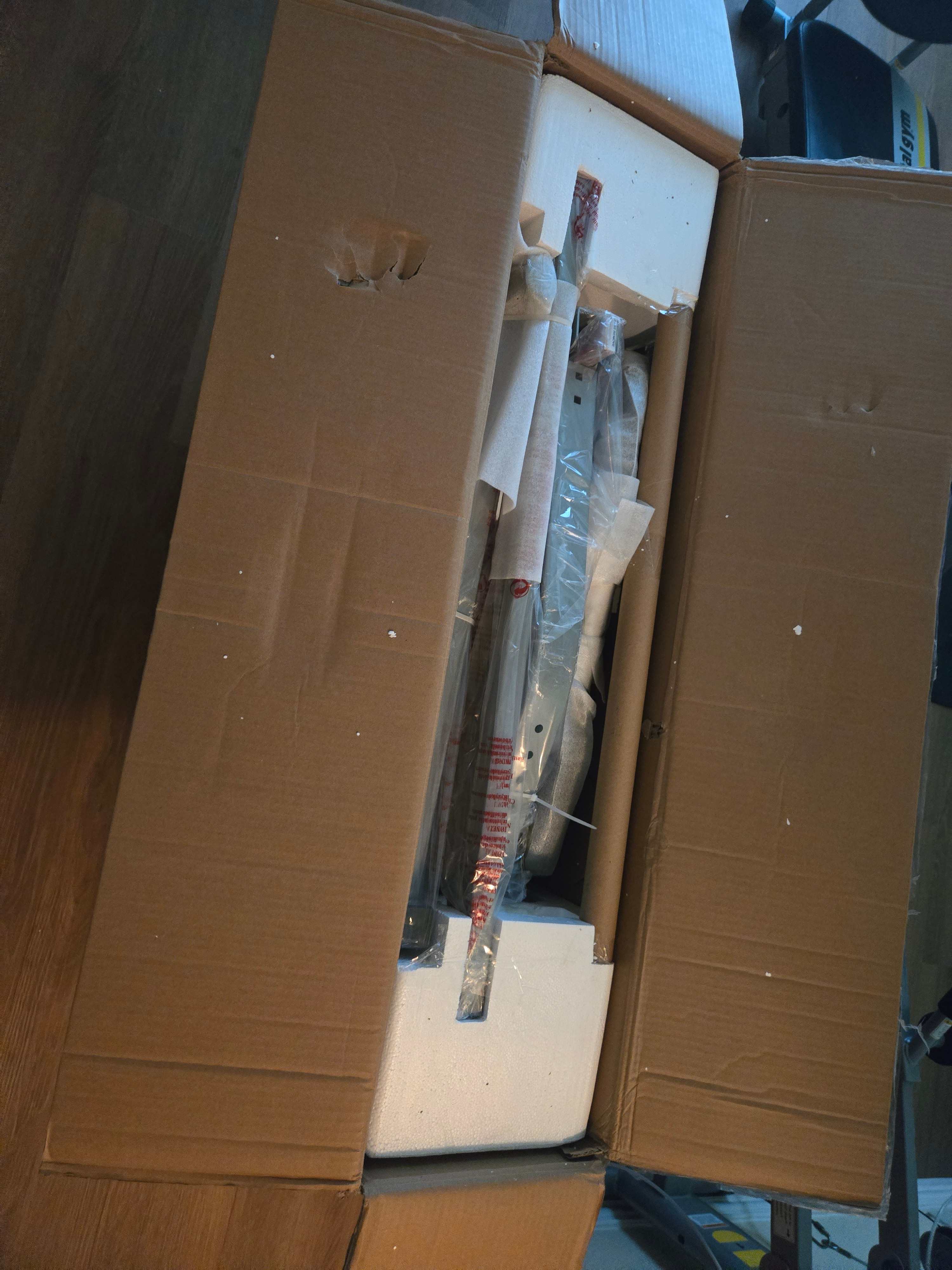 Box of IKEA desk parts ready for expert assembly by Mount & Fix Dallas