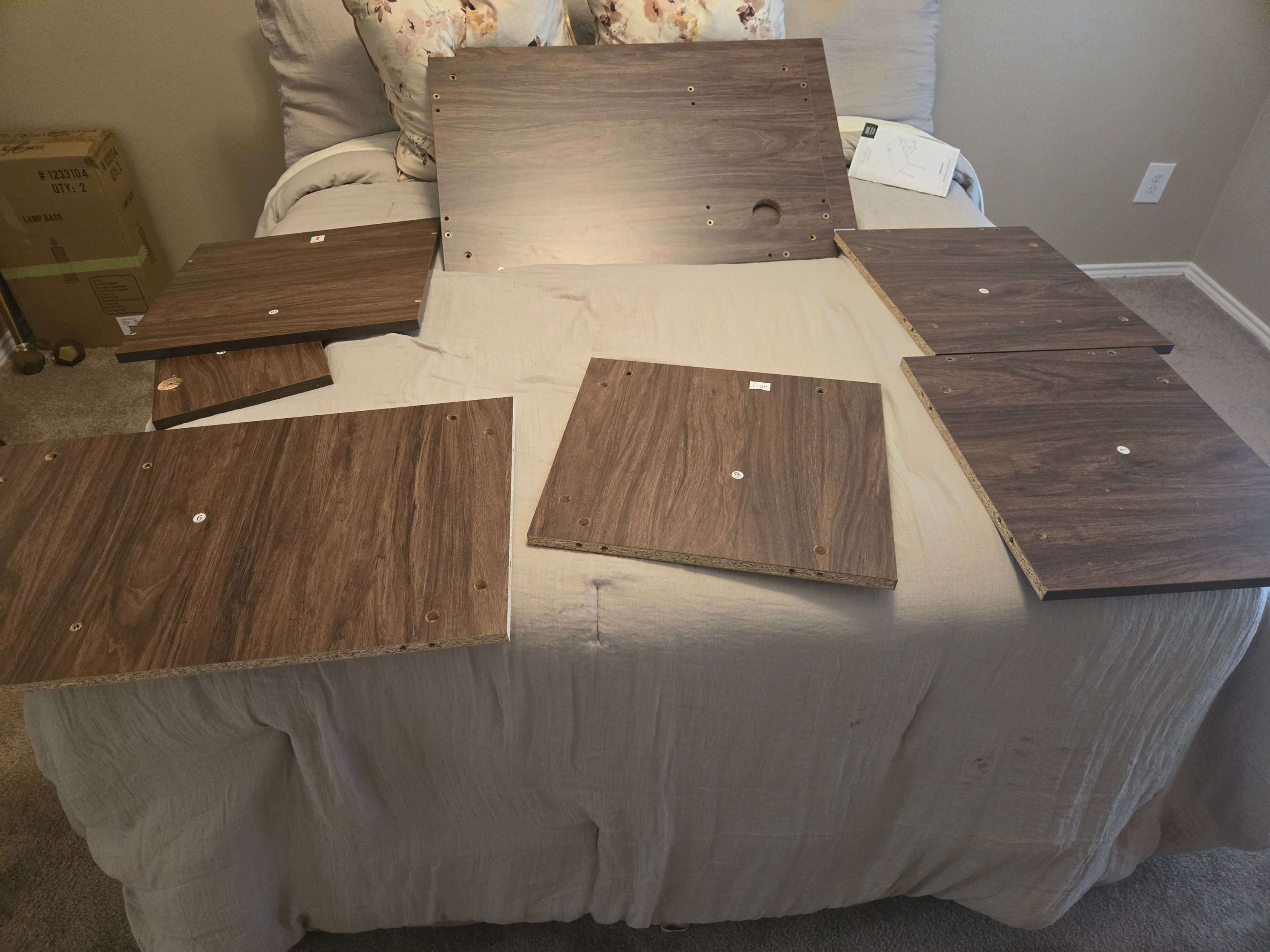 Wooden desk components prepared for assembly by Mount & Fix DFW