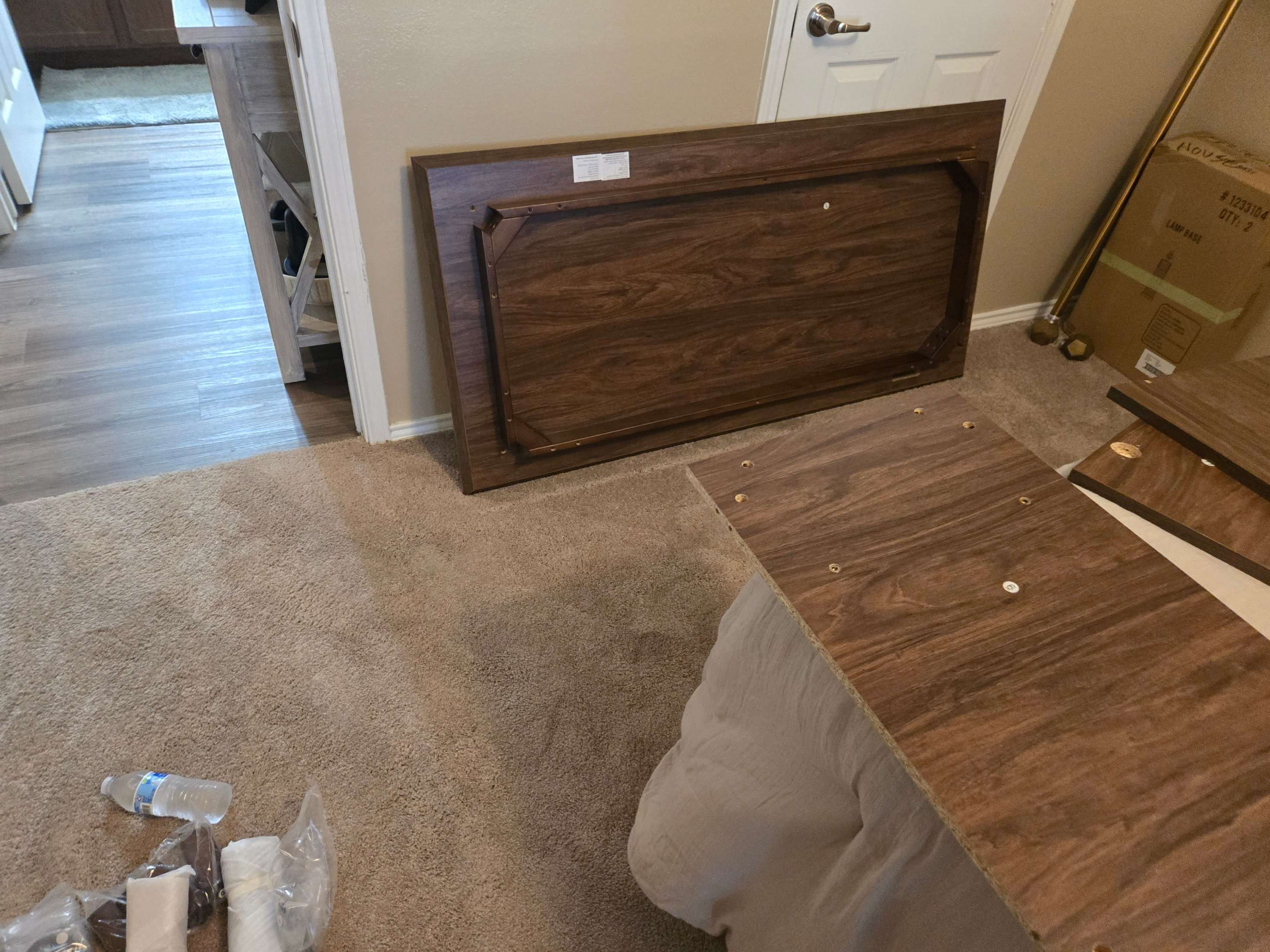 Desk components laid out for meticulous assembly by Mount & Fix Dallas