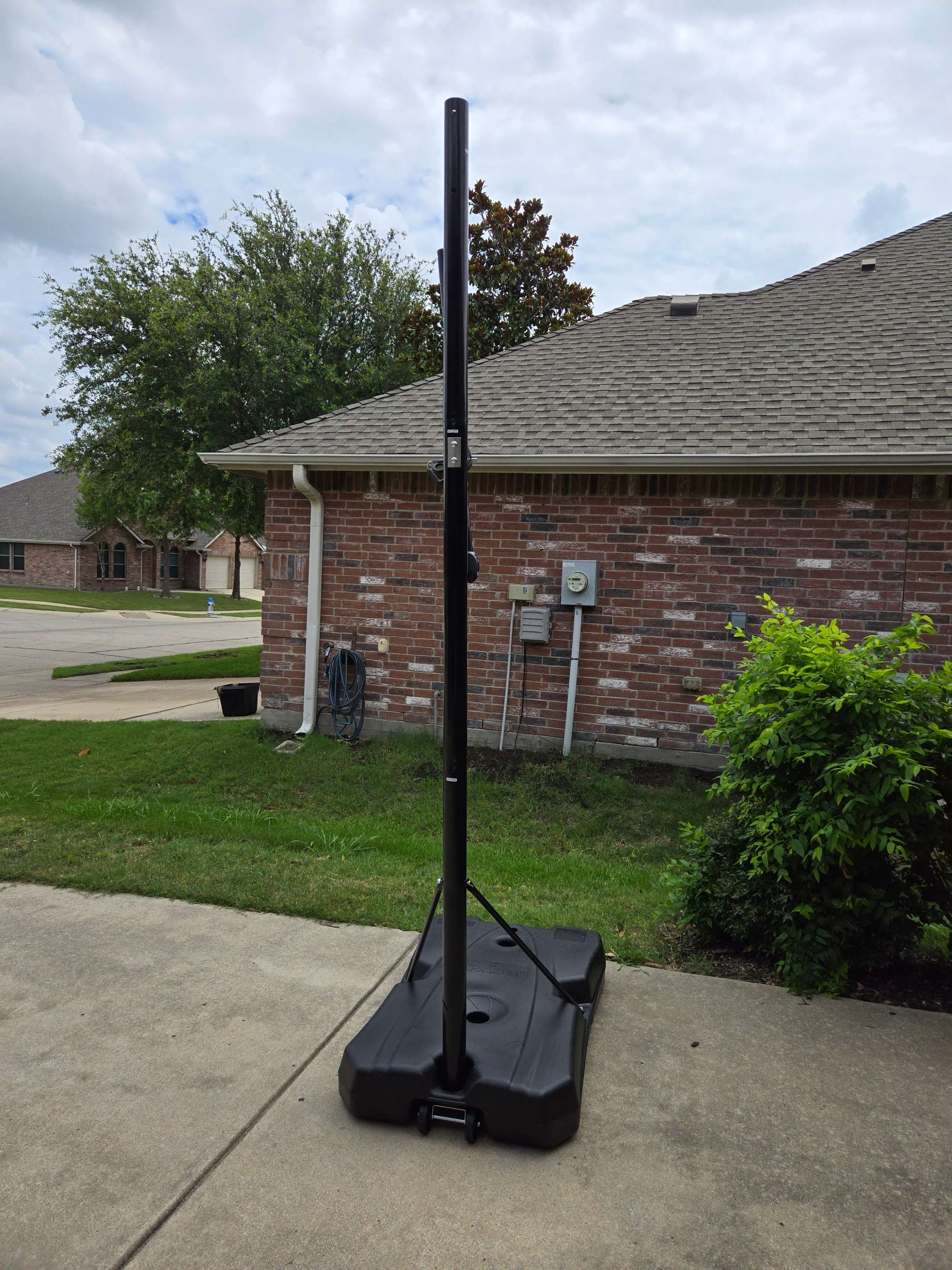 Assembly of a portable basketball hoop base by Mount & Fix in Dallas