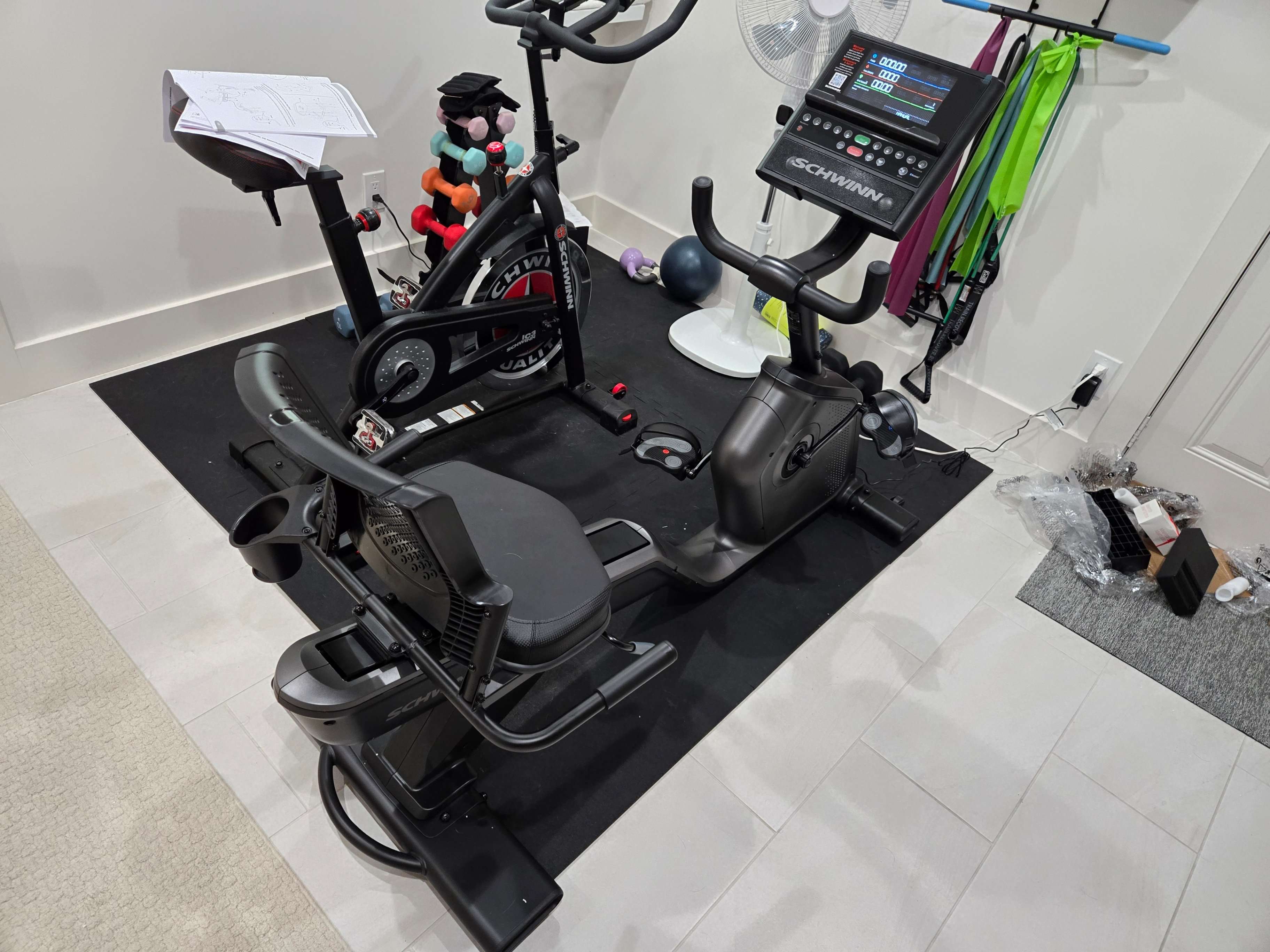 Parts of a recumbent exercise bike laid out for assembly by Mount & Fix Fort Worth