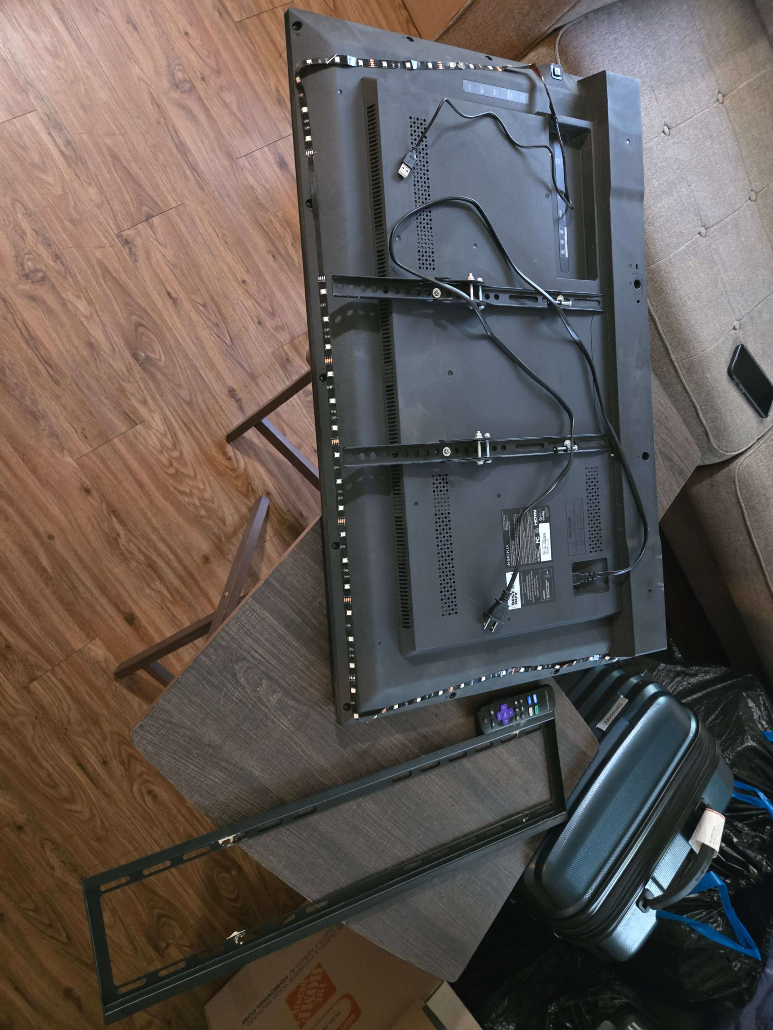 Close-up of a wall after TV mount removal by Mount & Fix, ready for patching
