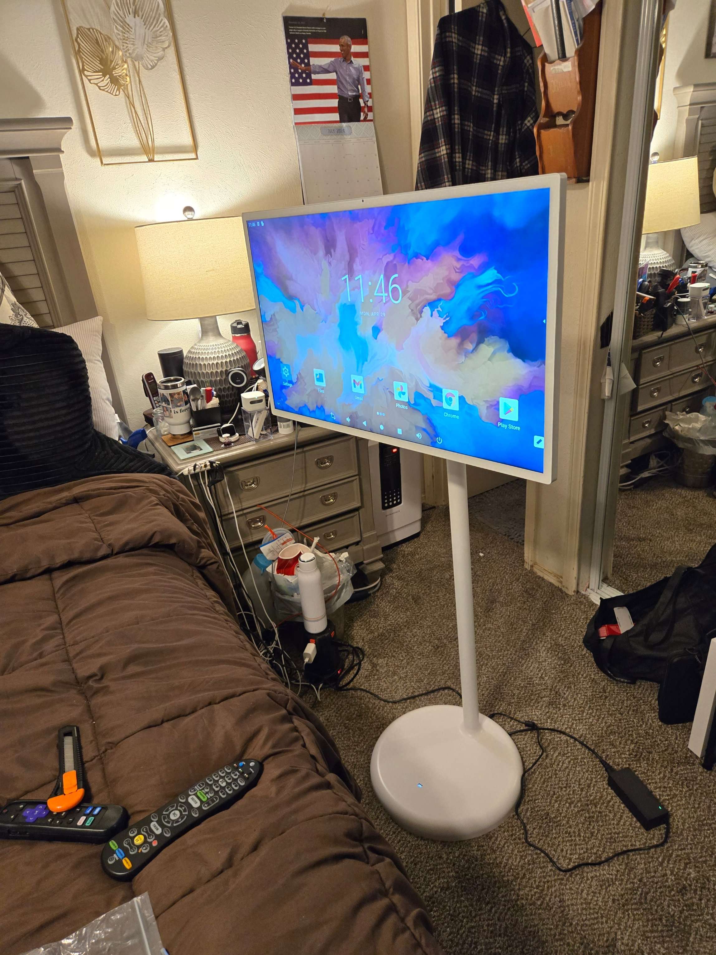 A television on a stand, with cables ready for setup by Mount & Fix Dallas
