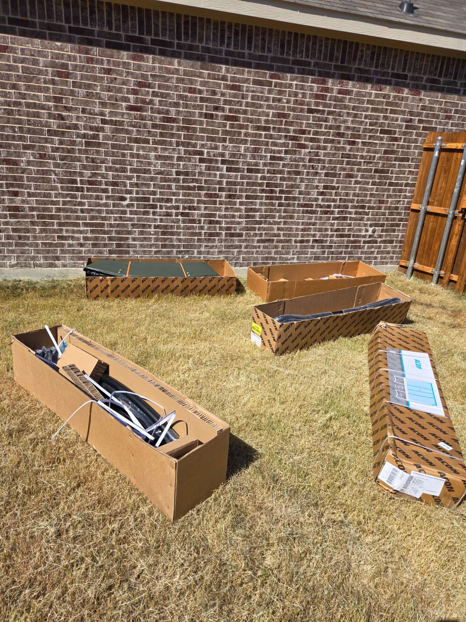Trampoline parts laid out for safe assembly by Mount & Fix DFW