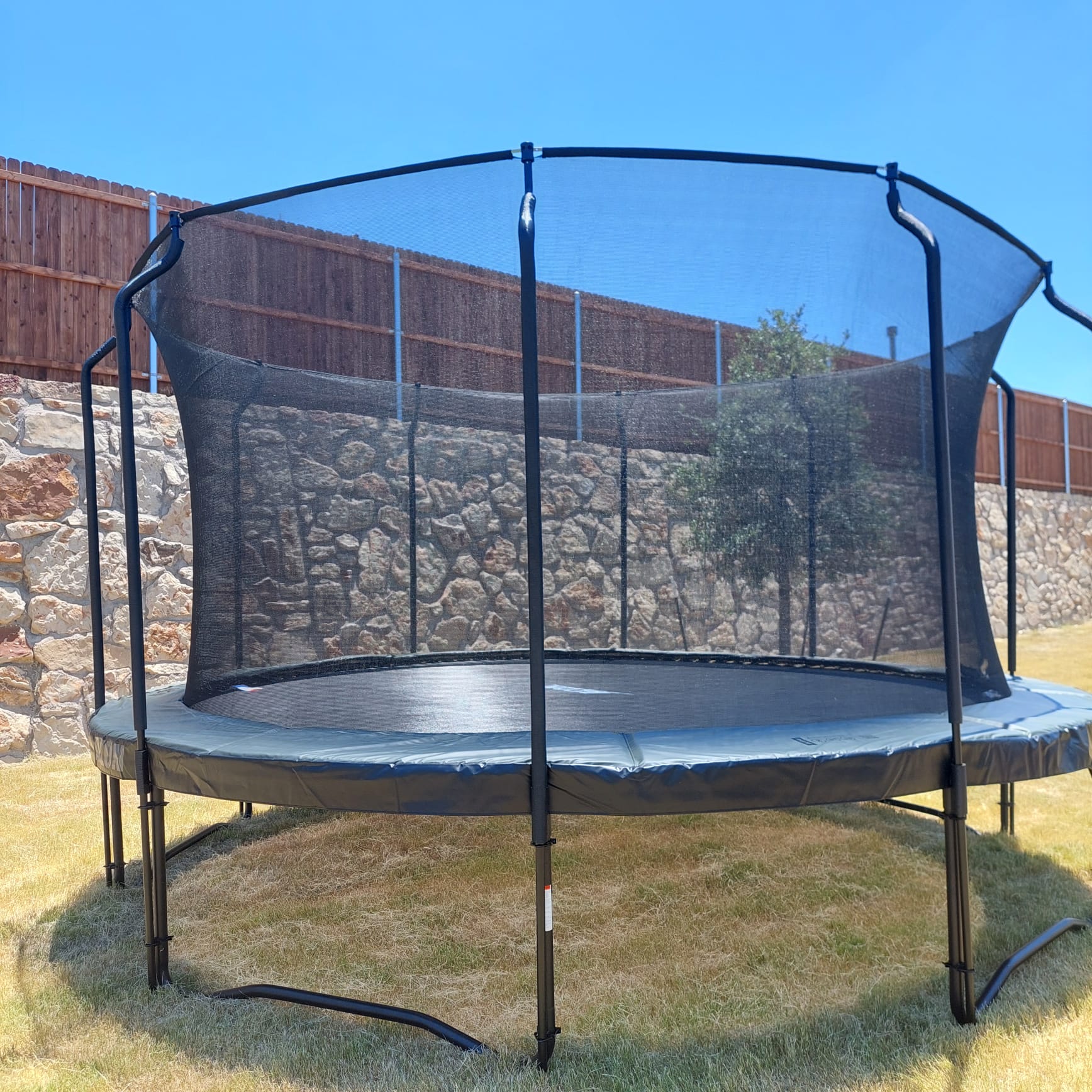 Attaching the jumping mat to a trampoline, assembly by Mount & Fix DFW