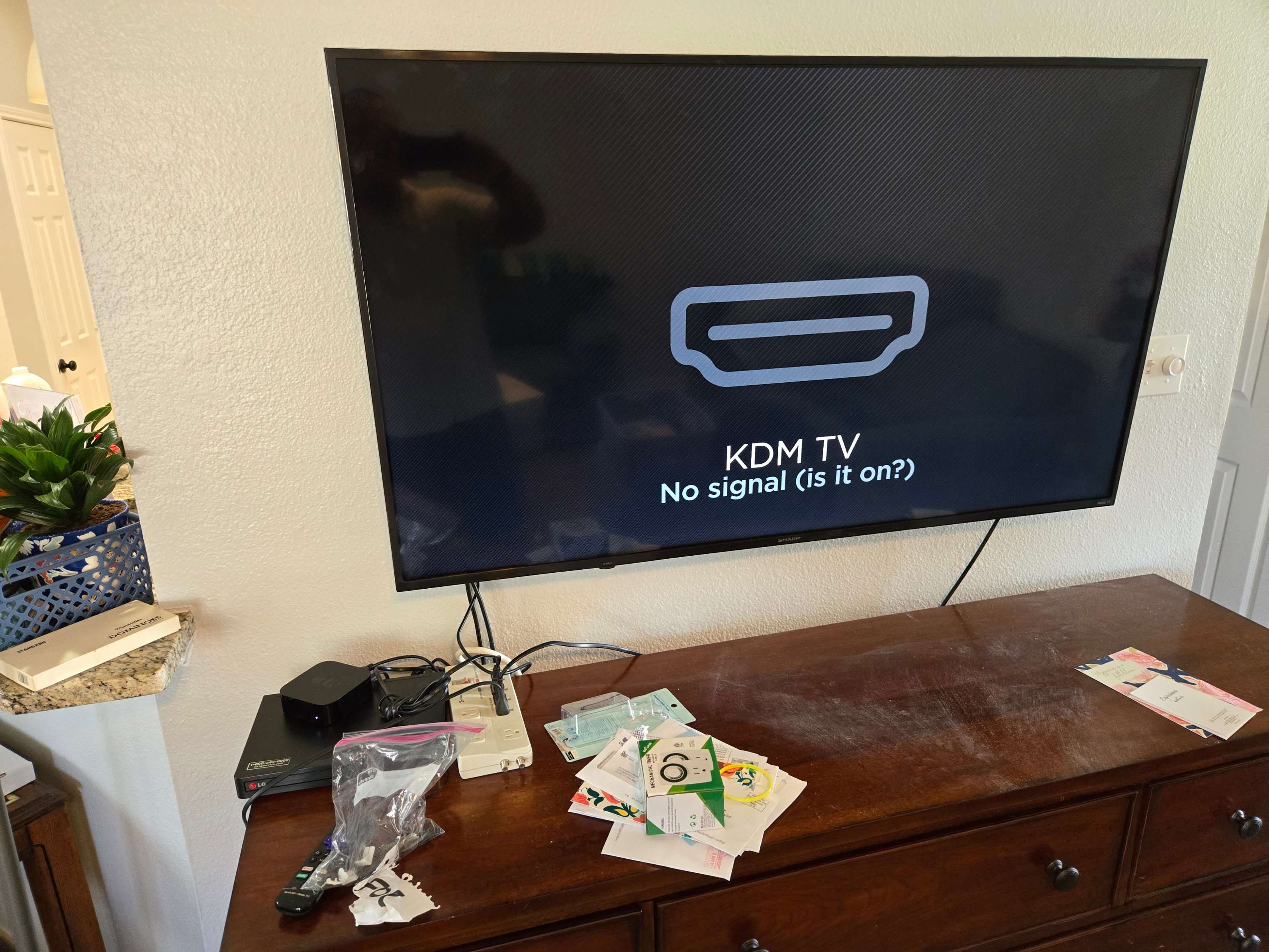 The back of a mounted TV showing neat cable management by Mount & Fix DFW