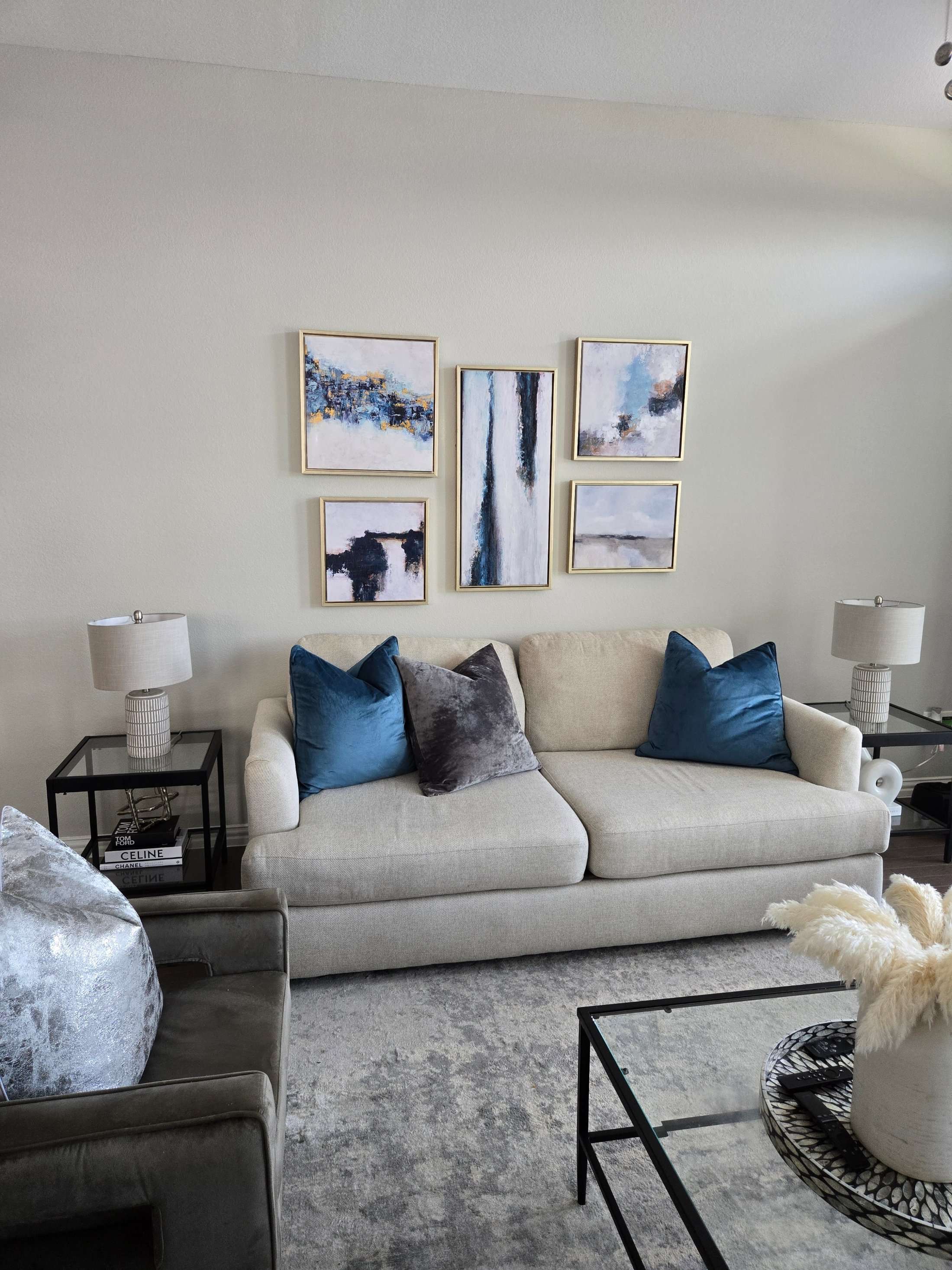 Gallery wall picture hanging service above a sofa by Mount & Fix, Dallas