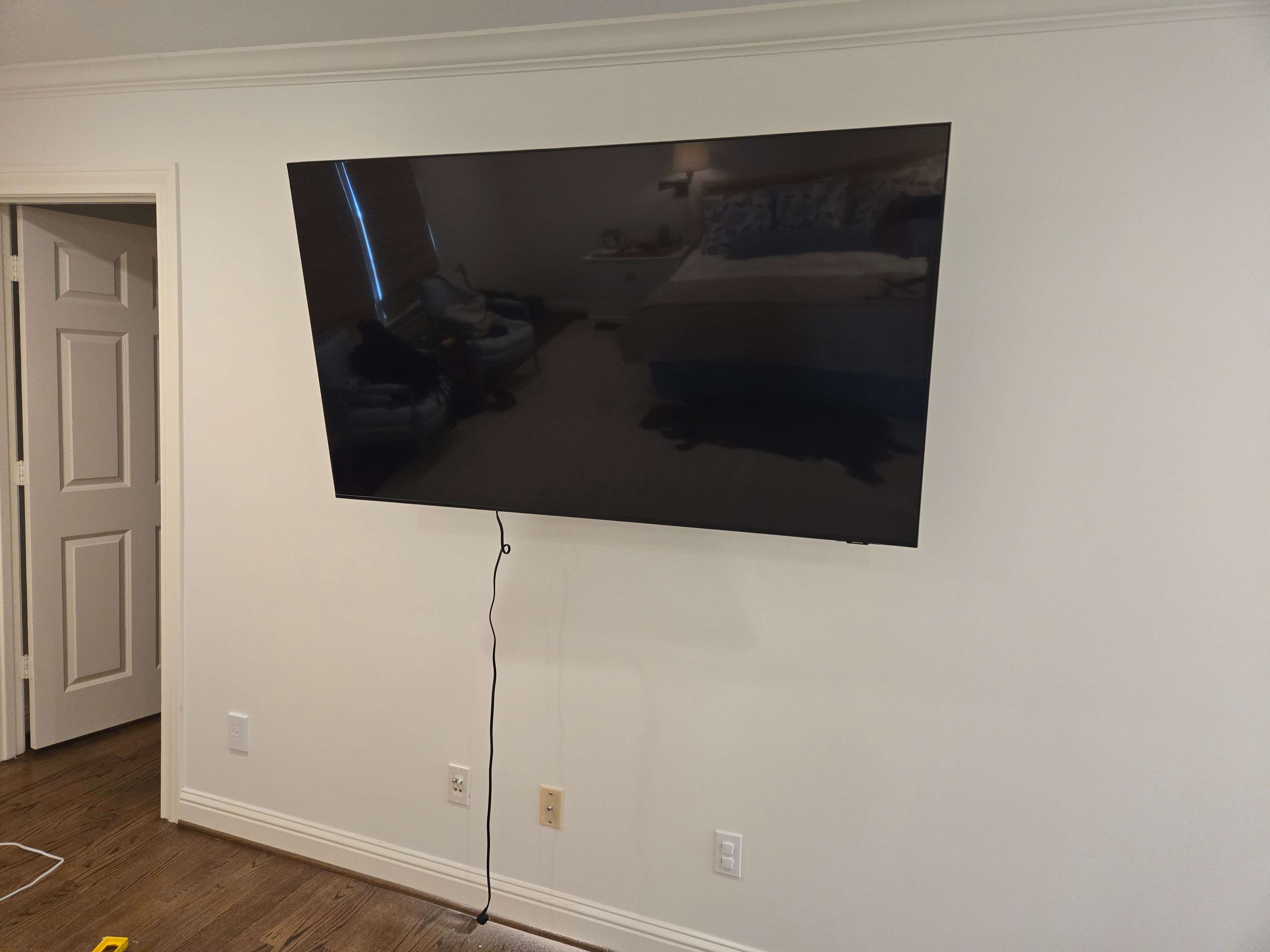 Close-up of a perfectly mounted OLED TV by Mount & Fix, DFW TV Installers